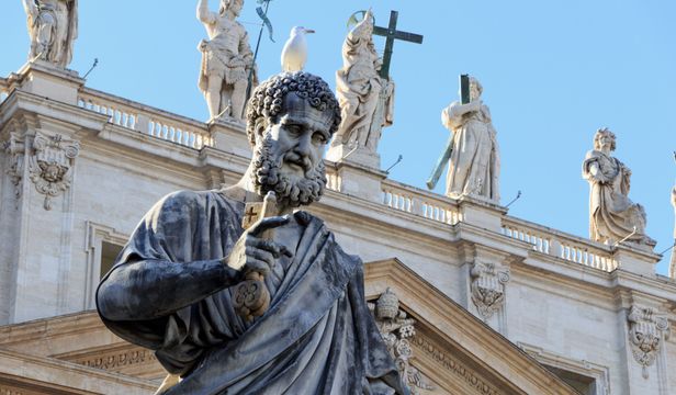 A close-up camera captures a stunning statue at Saint Peter's Square, an iconic landmark in the beautiful Vatican City.
