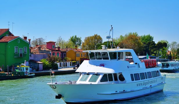 Daytime, cruise ships gracefully glide along Murano and Burano's canals, enveloped by their iconic charm and vibrant ambiance.