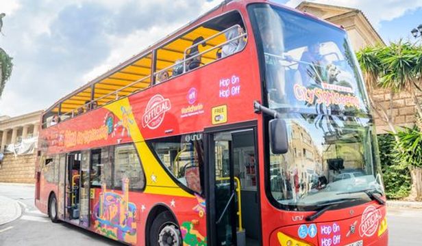 City Sightseeing Mallorca Hop-On, Hop-Off bus filled with eager passengers, ready to embark on an exciting exploration of Mallorca.