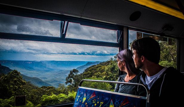 Captivated by mountain vistas: Passengers delight in the stunning views of the mountains while aboard the Hop-on Hop-off Sydney bus.