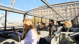 Tootbus Brussels: Passengers relishing a delightful journey, immersing in the city's charm and vibrant sights from the comfortable bus.