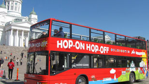 City Sightseeing Helsinki bus eagerly awaiting passengers, ready to embark on a captivating city exploration adventure.