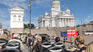 Passengers enjoying Helsinki Hop-on Hop-off Bus tour: sightseeing, convenience, and flexibility combined in one unforgettable experience.