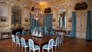 Elegant dining room: A beautiful glimpse of Versailles Palace's regal charm and grandeur, where history meets sophistication.