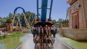 Tourists delight in the thrilling rides at Asterix Park, Paris, immersed in the excitement of this renowned amusement destination.