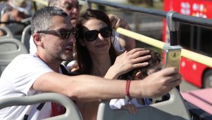 Passengers capturing joyful moments aboard the City Sightseeing Corfu: Hop-On, Hop-Off Bus, creating cherished memories through delightful selfies.