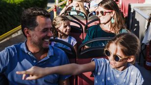 A father and daughter share joyous memories aboard the City Sightseeing Thessaloniki Hop-On, Hop-Off bus, creating cherished memories.
