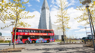 City Sightseeing Reykjavik Hop-On, Hop-Off bus resting peacefully in Reykjavik, ready to embark on an adventure through the city.