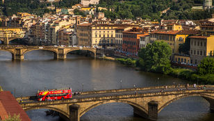 Gorgeous aerial view capturing Florence's iconic bridge over the river and the stunning cityscape, creating a breathtaking image.