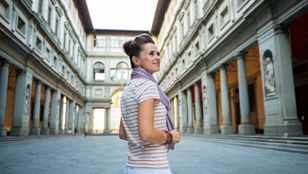 A young traveler captivated by the beauty of Florence's architecture, finding inspiration in the exquisite structures that surround them.