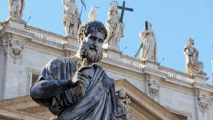 A close-up camera captures a stunning statue at Saint Peter's Square, an iconic landmark in the beautiful Vatican City.