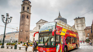 Discovering the City's Treasures: Passengers enjoy a thrilling ride on the bright red city sightseeing bus, exploring with joy.