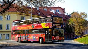Dynamic City Sightseeing Warsaw: Hop-On, Hop-Off bus bustling through Warsaw, brimming with enthusiastic passengers on a captivating city tour.