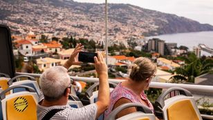 Passengers delight in their fully immersive Hop-On, Hop-Off Funchal bus ride, capturing the beauty of the cityscape in mesmerizing photographs.