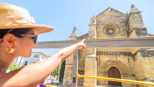 Young girl admiring the iconic architectural building of Cordoba from the City Sightseeing Cordoba Hop-On, Hop-Off bus.