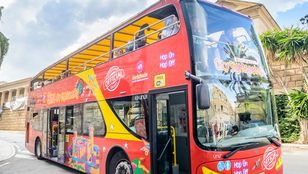 City Sightseeing Mallorca Hop-On, Hop-Off bus filled with eager passengers, ready to embark on an exciting exploration of Mallorca.