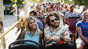 Delighted passengers in Toledo enjoy the scenic Hop-on Hop-off bus ride, exploring the city's attractions and soaking in the vibrant atmosphere.
