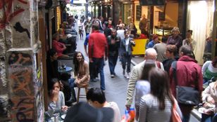 Colorful Melbourne city lanes and bustling cafes create a vibrant urban scene, beautifully captured in this stunning image.